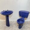 Dark blue toilet and basin with white background